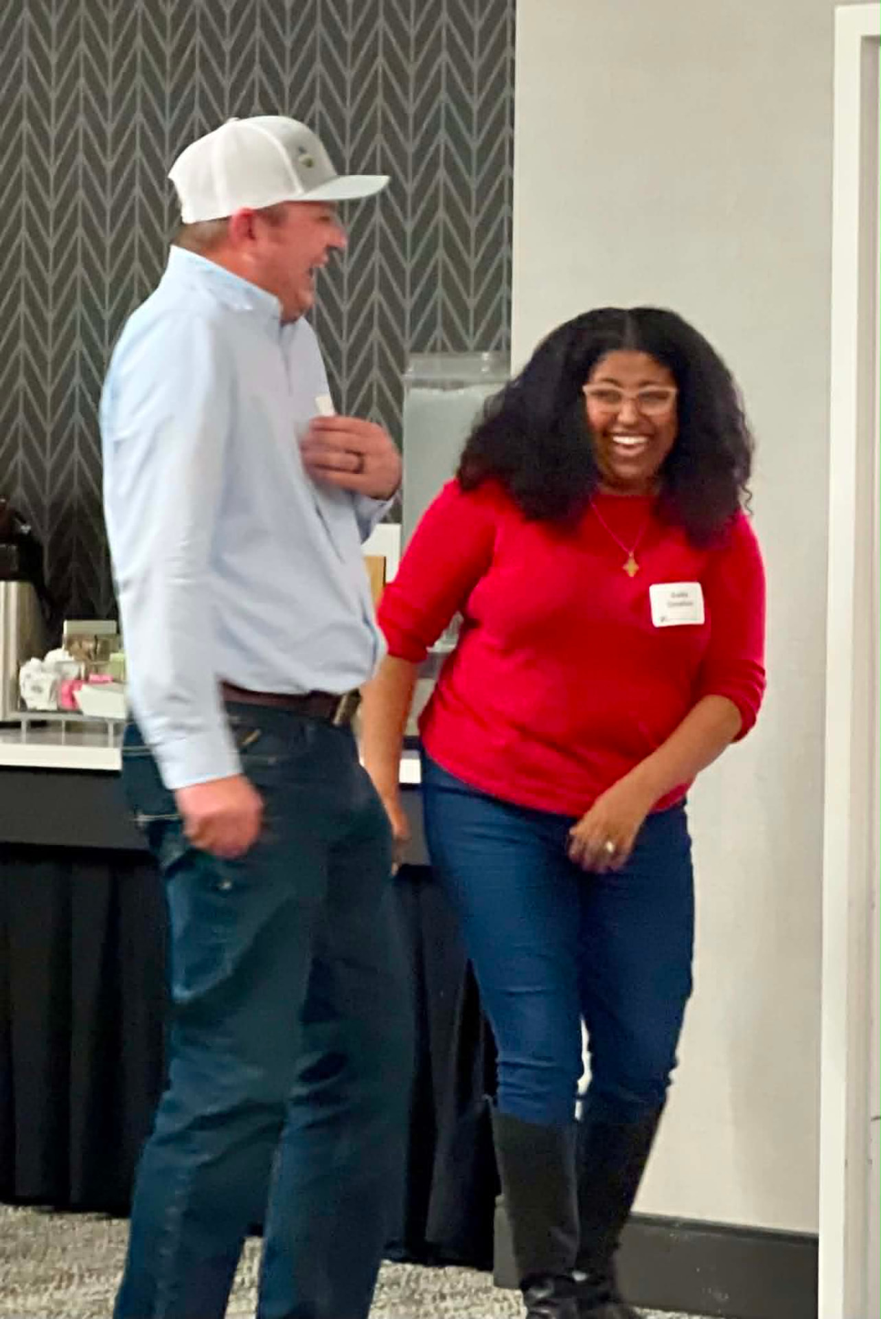 Two Academy participants sharing a laugh during a break