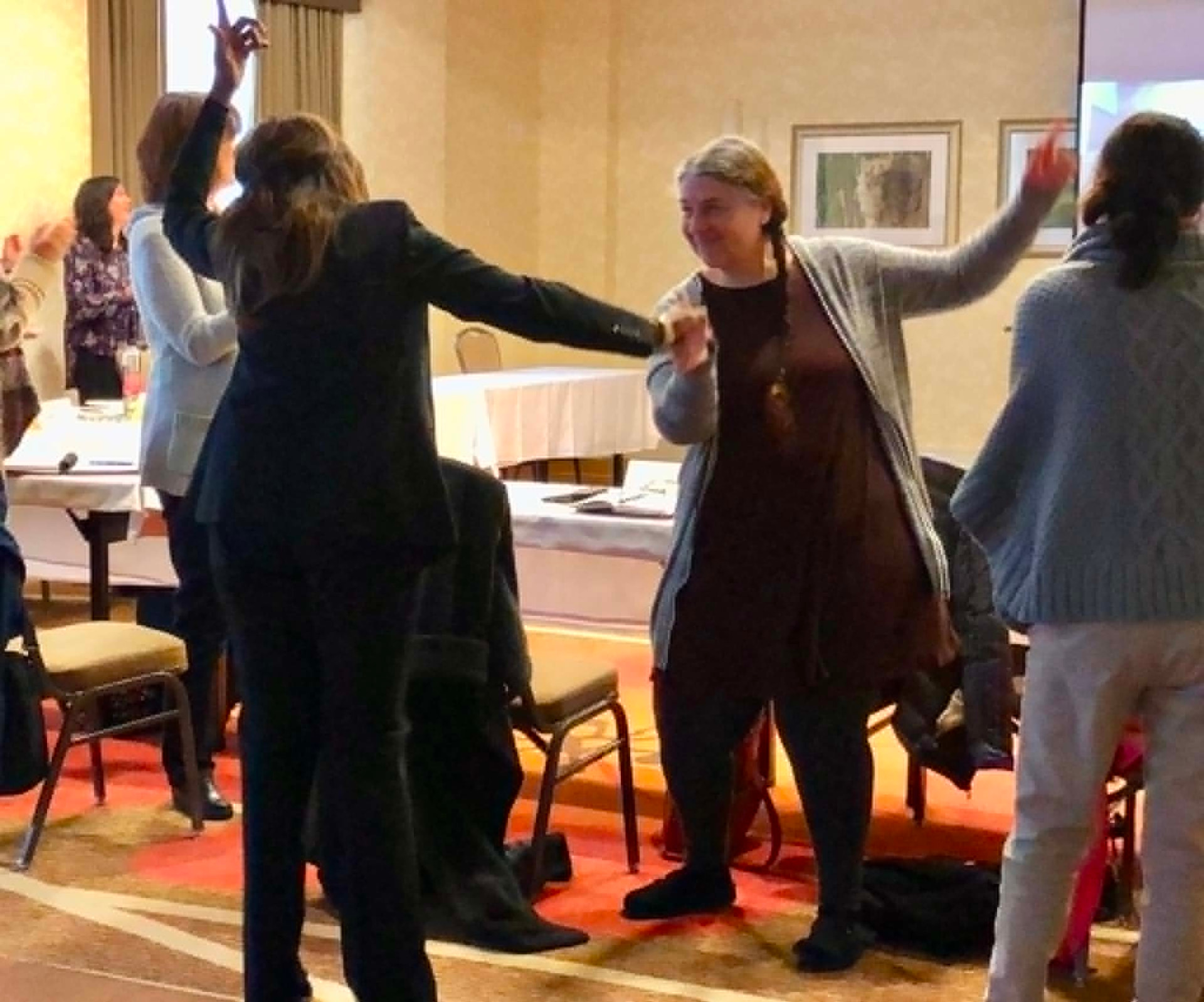 Academy participants dancing and celebrating during an energizer