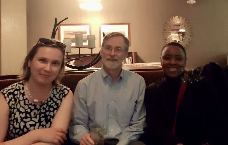 Three Academy participants sitting together on a couch during a break