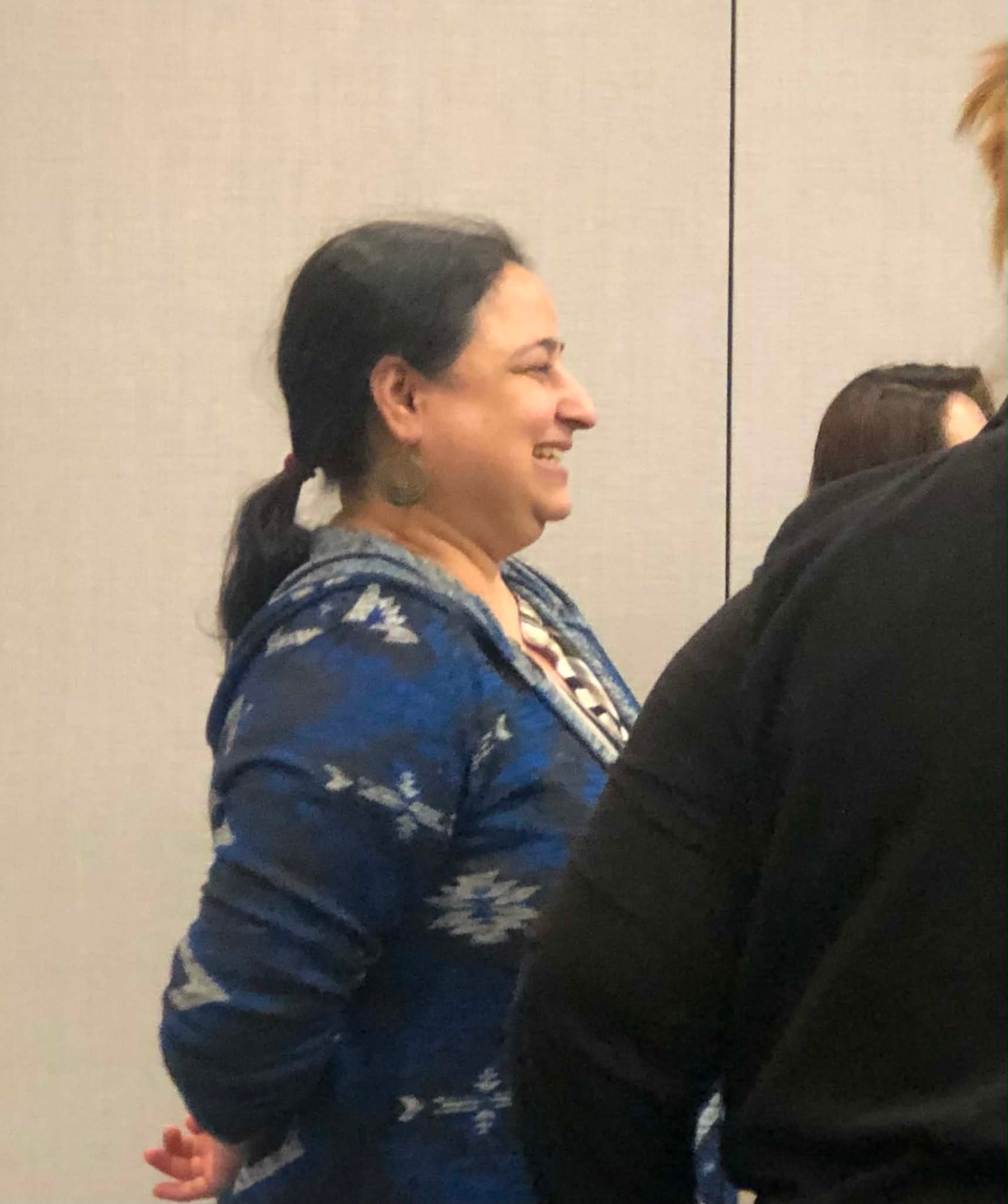 An Academy participant smiling during a session conversation