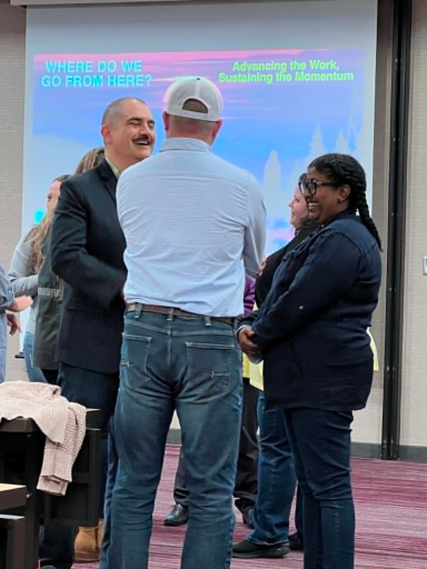 Academy participants in conversation during a learning session