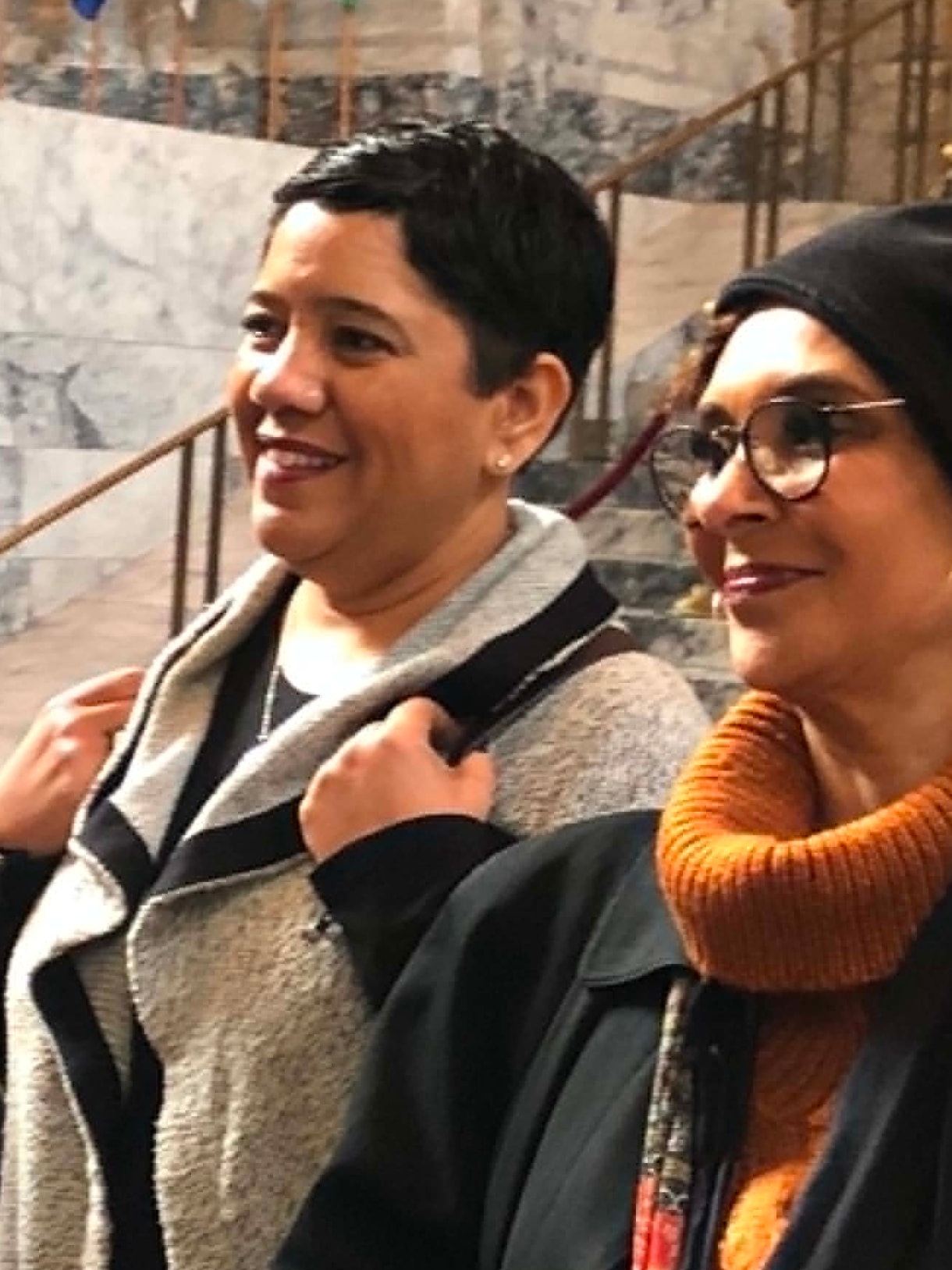 Two Academy participants smiling together during a visit to the Washington State Capitol