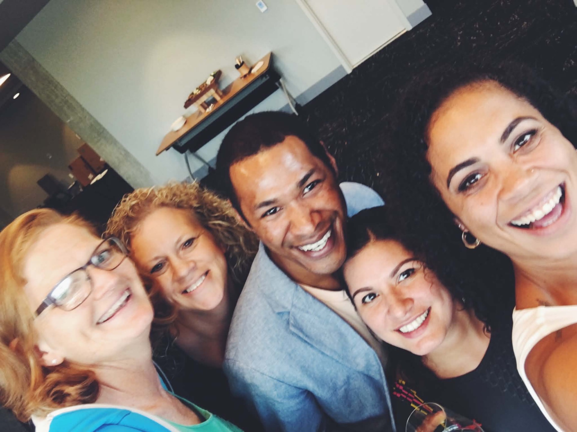 Five Academy participants smiling together after a cohort session